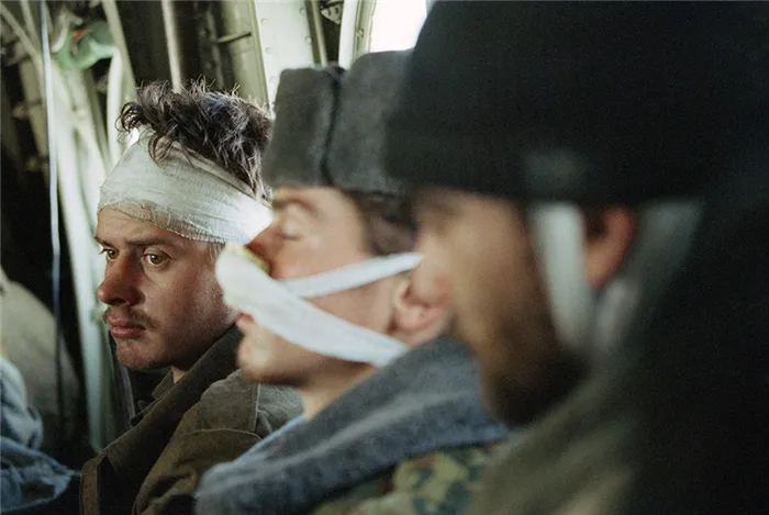 A wounded Russian soldier, being evacuated with his comrades, stares into space in a helicopter on his way out of Grozny, Feb. 3, 1995, as the fighting in the Chechen capital continues. The massive Russian force that invaded Chechnya has taken heavy losses against a small but determined guerrilla force. (AP Photo/Karsten Thielker)